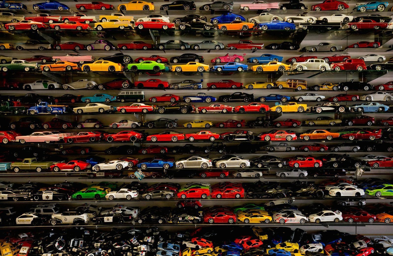 die-cast car collection on rack